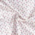 Tissu Coton imprimé Fimoa motifs abstraits rose pâle, jaune et noir sur fond Blanc - Par Coupon de 3m