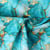 Tissu Coton imprimé  Auralis marbrures Dorées sur fond Bleu turquoise - Au mètre