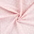 Tissu Popeline de Coton  patounes blanches Zumi sur fond Rose clair - Au mètre