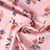 Tissu Imperméable imprimé Fleuris Caseille sur fond Rose pâle