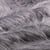 Tissu Fausse fourrure Fantasia sur fond Gris