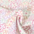 Tissu Popeline de Coton Fleurs lilas, vertes et roses sur fond Blanc